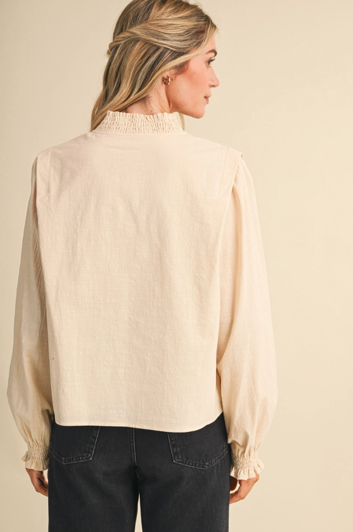 Embroidered Smocked Mock Neck Top
